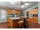 Kitchen features a central island with bar seating and modern appliances at 3738 E Hash Knife Draw Rd, Queen Creek, AZ 85140