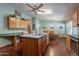 Eat-in kitchen features a functional island and an adjacent dining area at 3738 E Hash Knife Draw Rd, Queen Creek, AZ 85140