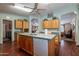 Bright kitchen with central island, an adjacent dining area, and ample storage at 3738 E Hash Knife Draw Rd, Queen Creek, AZ 85140