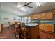 Eat-in kitchen featuring an island with bar seating and modern appliances at 3738 E Hash Knife Draw Rd, Queen Creek, AZ 85140