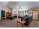 Inviting living room with a fireplace, comfortable seating, and ample natural light at 3738 E Hash Knife Draw Rd, Queen Creek, AZ 85140