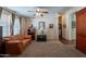 Spacious living room with a neutral color scheme, cozy seating, and an open layout at 3738 E Hash Knife Draw Rd, Queen Creek, AZ 85140