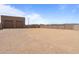Long driveway leading to a spacious lot with desert landscaping and a detached garage at 39302 N 30Th Dr, Phoenix, AZ 85086