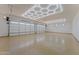 Spacious garage featuring epoxy floors, custom lighting, and dual doors at 39302 N 30Th Dr, Phoenix, AZ 85086