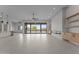 Expansive great room featuring neutral tile flooring, recessed lighting and sliding glass doors to backyard at 39302 N 30Th Dr, Phoenix, AZ 85086