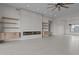 Open concept living room featuring a modern fireplace, floating shelves, tile floors, and recessed lighting at 39302 N 30Th Dr, Phoenix, AZ 85086