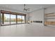 Bright living room with fireplace, tile floors, and large sliding glass doors to backyard at 39302 N 30Th Dr, Phoenix, AZ 85086