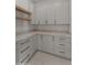 Pantry features custom cabinets, drawers, floating shelves, and ample countertop space at 39302 N 30Th Dr, Phoenix, AZ 85086