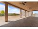 Outdoor covered patio featuring ceiling fans and brick flooring at 39302 N 30Th Dr, Phoenix, AZ 85086