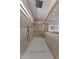 Long walk-in shower featuring dual shower heads, and frameless glass door at 39302 N 30Th Dr, Phoenix, AZ 85086