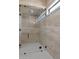 Stylish shower with frameless glass doors, and marble tile extending to the ceiling at 39302 N 30Th Dr, Phoenix, AZ 85086