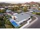 Aerial shot reveals home with modern pool, outdoor seating, and lush greenery in a neighborhood setting at 4002 N 33Rd Pl, Phoenix, AZ 85018