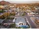 Drone shot showcases home with pool, spa, and lush landscaping against a mountain backdrop at 4002 N 33Rd Pl, Phoenix, AZ 85018