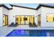 Modern home with a sleek pool, patio furniture, and expansive glass doors for indoor-outdoor living at 4002 N 33Rd Pl, Phoenix, AZ 85018