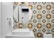 Stylish bathroom featuring a patterned accent wall and floating sink at 4002 N 33Rd Pl, Phoenix, AZ 85018