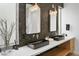 Stunning bathroom features dual sinks, mosaic tile wall, and modern fixtures at 4002 N 33Rd Pl, Phoenix, AZ 85018