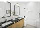 Bright bathroom featuring dual sinks, a soaking tub, and modern finishes at 4002 N 33Rd Pl, Phoenix, AZ 85018