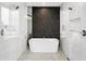 Spa bathroom showcasing a sleek standalone tub and frameless glass shower at 4002 N 33Rd Pl, Phoenix, AZ 85018