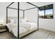 Serene bedroom with a canopy bed, soft rug, and natural light at 4002 N 33Rd Pl, Phoenix, AZ 85018