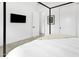 Modern bedroom featuring sleek sliding closet doors and a minimalist black four-poster bed at 4002 N 33Rd Pl, Phoenix, AZ 85018