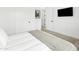 Minimalist bedroom with a plush bedspread and neutral color scheme, with ensuite bathroom at 4002 N 33Rd Pl, Phoenix, AZ 85018