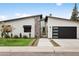Attractive home exterior boasts modern design, a charming yard, and an attached garage, perfect for contemporary living at 4002 N 33Rd Pl, Phoenix, AZ 85018