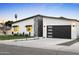 Beautiful home exterior offers contemporary appeal, landscaped grounds, and a modern garage, enhancing overall aesthetics at 4002 N 33Rd Pl, Phoenix, AZ 85018