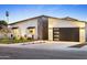 Charming home exterior features modern accents, a well-manicured lawn, and a contemporary garage door, perfect for modern living at 4002 N 33Rd Pl, Phoenix, AZ 85018