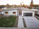 Striking modern home with desert landscaping, a dark garage door, and clean architectural lines at 4002 N 33Rd Pl, Phoenix, AZ 85018