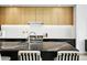 Modern kitchen boasts an island with seating, stainless appliances, and sleek cabinets at 4002 N 33Rd Pl, Phoenix, AZ 85018