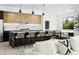 Open concept kitchen with a large island, stylish barstools, and view of the living area at 4002 N 33Rd Pl, Phoenix, AZ 85018