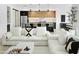 Modern living room with a view of the kitchen, featuring sofas and stylish decor at 4002 N 33Rd Pl, Phoenix, AZ 85018