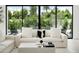 Sunlit living room with comfortable sofa, modern accents, and expansive views of the lush backyard at 4002 N 33Rd Pl, Phoenix, AZ 85018