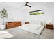 Spacious bedroom with contemporary furnishings, including a sleek dresser and serene lighting at 4002 N 33Rd Pl, Phoenix, AZ 85018