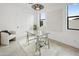 Bright home office with a glass desk, ample natural light, and modern decor at 4002 N 33Rd Pl, Phoenix, AZ 85018