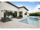 Stunning backyard pool with tanning chairs, clean tiling, and lush landscaping for relaxing outdoor living at 4002 N 33Rd Pl, Phoenix, AZ 85018