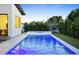 Clean and modern pool with Baja shelf, ideal for leisure and enjoying outdoor living at 4002 N 33Rd Pl, Phoenix, AZ 85018