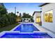 Luminous pool and spa area with outdoor lounge seating, accented by stylish landscaping and ambient lighting at 4002 N 33Rd Pl, Phoenix, AZ 85018