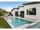 Captivating pool area with lush grass, outdoor seating, and a modern pool, great for entertaining guests at 4002 N 33Rd Pl, Phoenix, AZ 85018