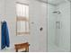 Modern bathroom featuring a glass-enclosed shower with decorative tile and neutral colors at 40990 W Agave Rd, Maricopa, AZ 85138