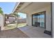 Covered patio with access to backyard seating area, providing a seamless indoor-outdoor living experience at 4445 W Oraibi Dr, Glendale, AZ 85308