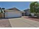 Charming single-Gathering home featuring a two-car garage and well-maintained front yard at 4445 W Oraibi Dr, Glendale, AZ 85308