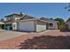 Charming single-story home featuring a two-car garage, well-maintained driveway and low maintenance landscaping at 4445 W Oraibi Dr, Glendale, AZ 85308