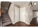 Entryway featuring hardwood floors, stairs to the upper level, and access to storage and the garage at 44859 W Sage Brush Dr, Maricopa, AZ 85139