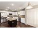 Modern kitchen featuring a center island, stainless steel appliances, granite countertops, and lots of storage at 44859 W Sage Brush Dr, Maricopa, AZ 85139