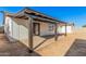 Back patio has a covered patio with black beams and a concrete floor at 4611 N 79Th Dr, Phoenix, AZ 85033