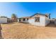 Wide shot of the backyard showing the buildings and a fence at 4611 N 79Th Dr, Phoenix, AZ 85033