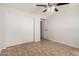 Bedroom featuring a closet with sliding doors and tile flooring at 4611 N 79Th Dr, Phoenix, AZ 85033