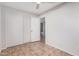 Bright bedroom with a closet and a glimpse into an adjacent bathroom at 4611 N 79Th Dr, Phoenix, AZ 85033