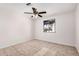 Light bedroom featuring neutral colors and a window at 4611 N 79Th Dr, Phoenix, AZ 85033
